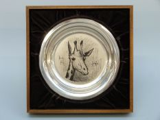 A white metal shallow plate decorated with a giraffe by Bernard Buffet,