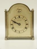 A silvered mantel clock with Mappin and Webb to Roman dial,