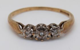 A 9ct gold ring set with three diamonds, 1.