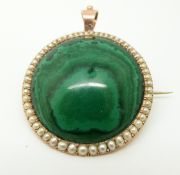 A 9ct gold pendant set with a large malachite cabochon surrounded by graduating seed pearls 3.