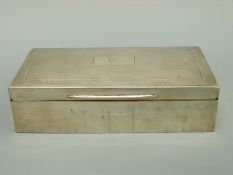 A George V hallmarked silver cigarette box with engine turned lid, Birmingham 1929 maker D Bros,