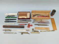 A collection of vintage pens including Parker, artist's dip pens, ephemera,