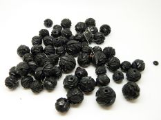 A quantity of carved jet beads