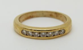 An 18ct gold ring set with diamonds, 3.