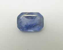 A cornflower blue emerald cut sapphire measuring approximately 6.