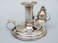 An Austrian white metal chamber stick and snuffer,