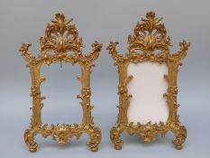 A pair of gilt metal ornate photograph frames,