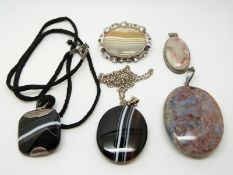 A lace agate pendant, a large moss agate pendant,