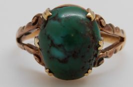 A 9ct gold Edwardian ring set with a large turquoise cabochon, B'ham 1903, 3.