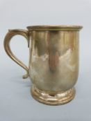 A George V hallmarked silver baluster shaped tankard, Birmingham 1939 maker Adie Brothers, height 9.