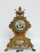 A late 19thC balloon style ormolu mantel clock with Sevres style panels and dial decoration,