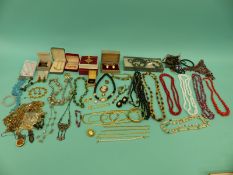 A collection of costume jewellery including chains,