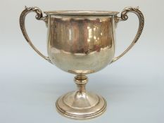 A George V hallmarked silver twin-handled trophy cup,