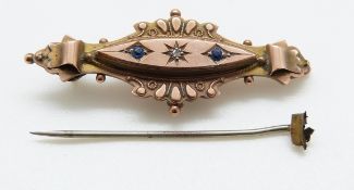 A 9ct gold Victorian brooch set with a diamond and two blue stones, 2.2g, 4.