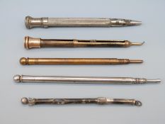 Propelling pencil, toothpick with yellow metal mount,