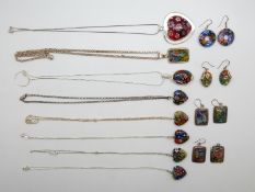 A collection of silver pendants and earrings set with millefiori