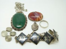 A collection of silver jewellery to include a pendant set with malachite,