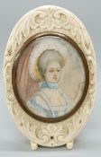 A 19thC portrait miniature on ivory, head and shoulders bust of a lady in fine attire,