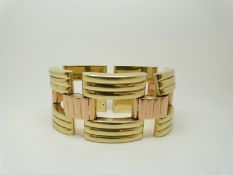 A Tiffany & Co bi-coloured 14k gold bracelet made up of rectangular ridged links, 85.3g, width 3.