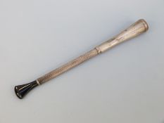 A hallmarked silver engine turned cheroot holder with spring ejector system, Birmingham 1928,