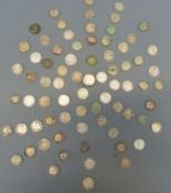 A collection of silver threepenny coins, including a curious sealed cylinder made from 3d pieces,