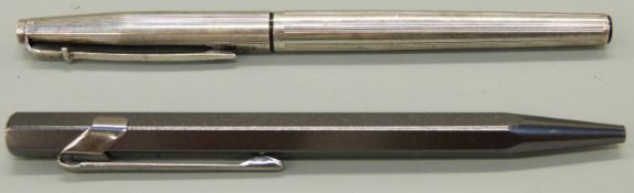 Two Caran d'Ache ballpoint pens comprising 849 with metallic grey barrel (12cm) and a silver plated