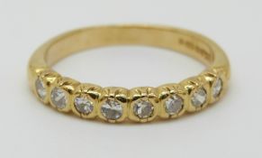An 18ct gold half eternity ring set with diamonds, 3.