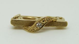 A 14ct gold pearl clip set with a diamond in original Garrard box