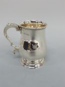 A Victorian hallmarked silver tankard of baluster form, London 1874 maker Robert Harper,