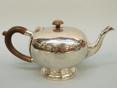 A George V Mappin & Webb bullet shaped hallmarked silver teapot, London 1926, length 23.