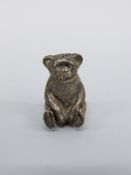 A George V hallmarked silver novelty pepper formed as a teddy bear,