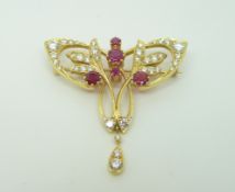 An 18ct gold brooch set with diamonds and synthetic rubies in the Art Nouveau style by T.O.D, 3.
