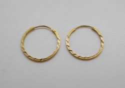 A pair of 18ct gold hoop earrings, 2.