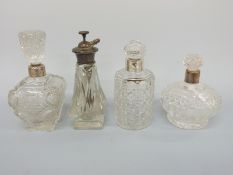 Two hallmarked silver mounted dressing table bottles and two other dressing table bottles,