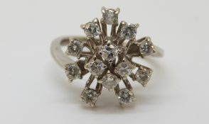 An 18ct white gold ring set with diamonds, 4.