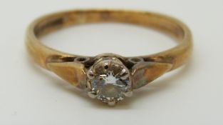 A 9ct gold ring set with a round cut diamond of approximately 0.