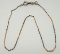 A bi-coloured watch chain made up of elongated rectangular links
