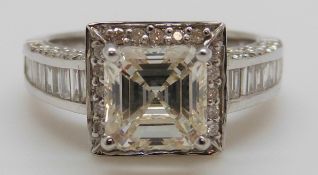 An 18ct white gold ring set with a square cut diamond of approximately 1.