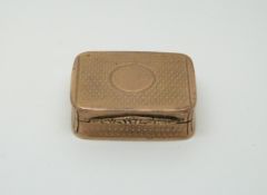 A hallmarked 9ct gold engine turned pill box,