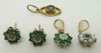 A 9ct gold pendant set with emeralds and a diamond with matching earrings together with two other