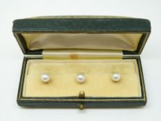 Three 9ct gold studs each set with a pearl in original box