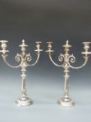 A large pair of silver three branch plated candelabra,