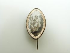 A Victorian morning brooch set with a painted ivory plaque depicting a woman with a harp, 2.4 x 1.