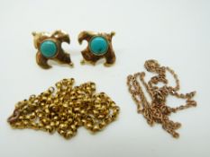 A pair of yellow metal earrings set with turquoise cabochons and two yellow metal chains