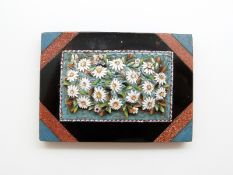 A 19thC micro mosaic paperweight depicting daisies and sunshine set to the corners, 6.