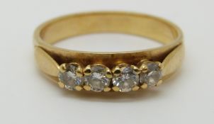A 9ct gold ring set with four diamonds, 3.