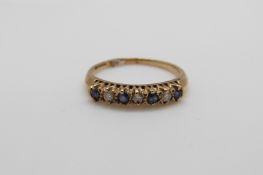 A 9ct gold ring set with diamonds and sapphires (size P/Q)