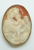 A 9ct gold pendant/ brooch set with a large cameo depicting a religious scene