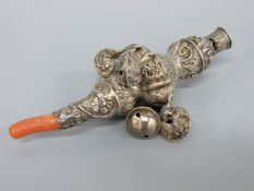 A Georgian hallmarked silver babies rattle with inset coral teether and whistle (Birmingham,