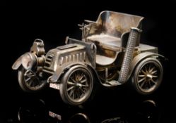 An Edward VII novelty hallmarked silver table lighter formed as a veteran car,